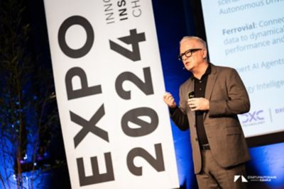 Howard Boville speaking at STARTUP AUTOBAHN Expo2024 - Sustainability is AI’s new frontier | DXC Technology Insights