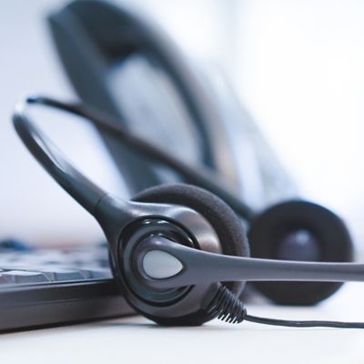 headphones on desk, AWS | DXC Technology