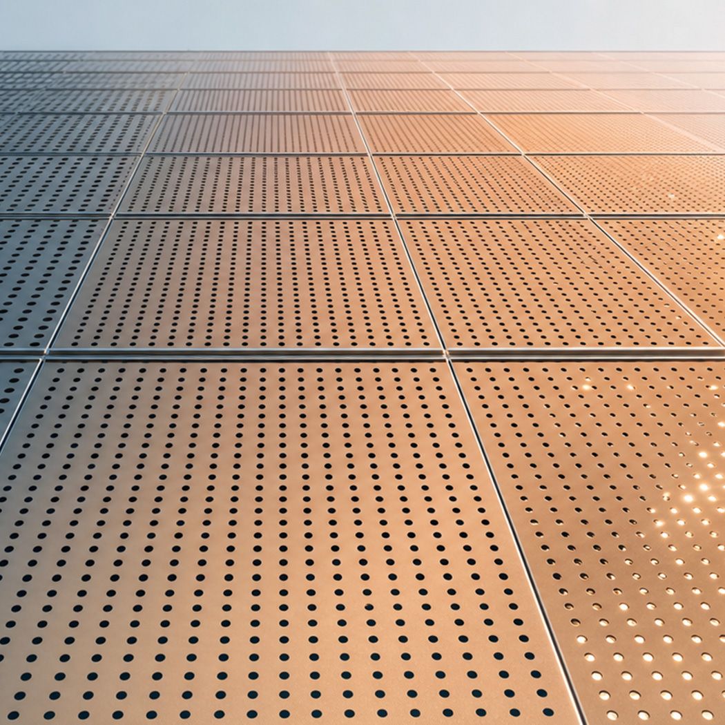 Solar panel array photographed from above at sunset