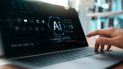 Businessman uses computer and AI to help analyze data, representing regulatory business automation software and services in Life Sciences | DXC Technology