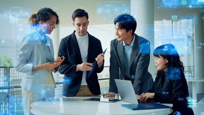  Four people in conference room analyzing data - SAP + Databricks: Putting data and AI to work | DXC Technology Insights