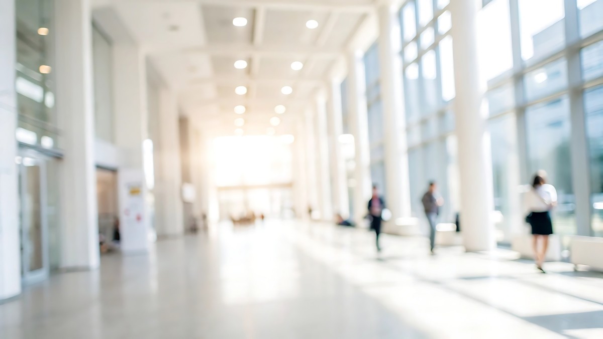 Business people walking in office representing People & Culture Advisory services | DXC Technology