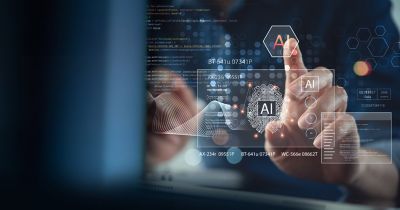 Business person using AI technology for data analysis, representing AI capabilities for Assure Commercial and Specialty | DXC Technology Capabilities