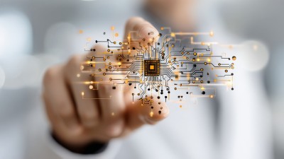 A person interacts with a futuristic circuit board, symbolizing advanced technology.