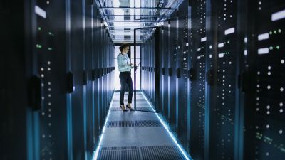 IT worker conducting data center check, Mainframe Modernization | DXC Technology