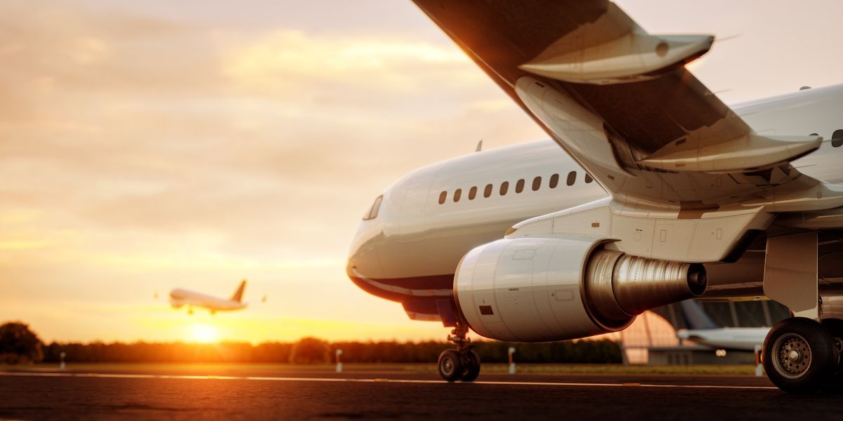 White commercial airplane standing on the airport runway at sunset. Passenger airplane taking off. Airplane concept 3D illustration.