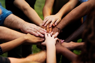 Group of people with their hands together 