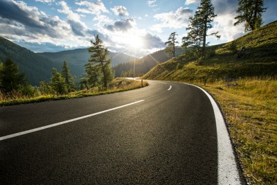 Asphalt road in Austria, Alps in a beautiful summer day, Nockalmstrasse.