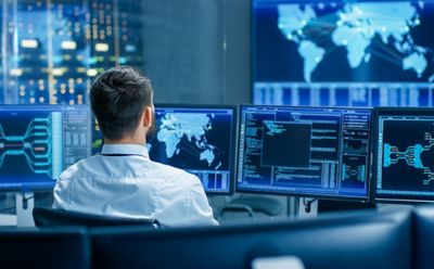 man observing securlty data,  AWS | DXC Technology