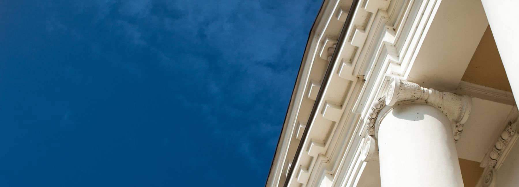 Architectural Column Against clear Blue Sky, Public Sector | DXC Technology