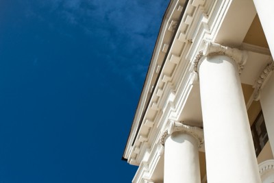 Low angle view of sky and columns Architectural Column Against clear Blue Sky