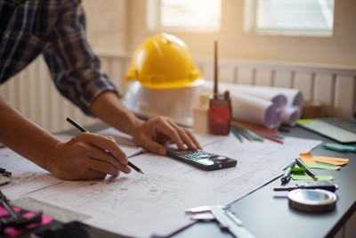 Concept Architect  and desk of Architectural project in construction site or office building with mining light