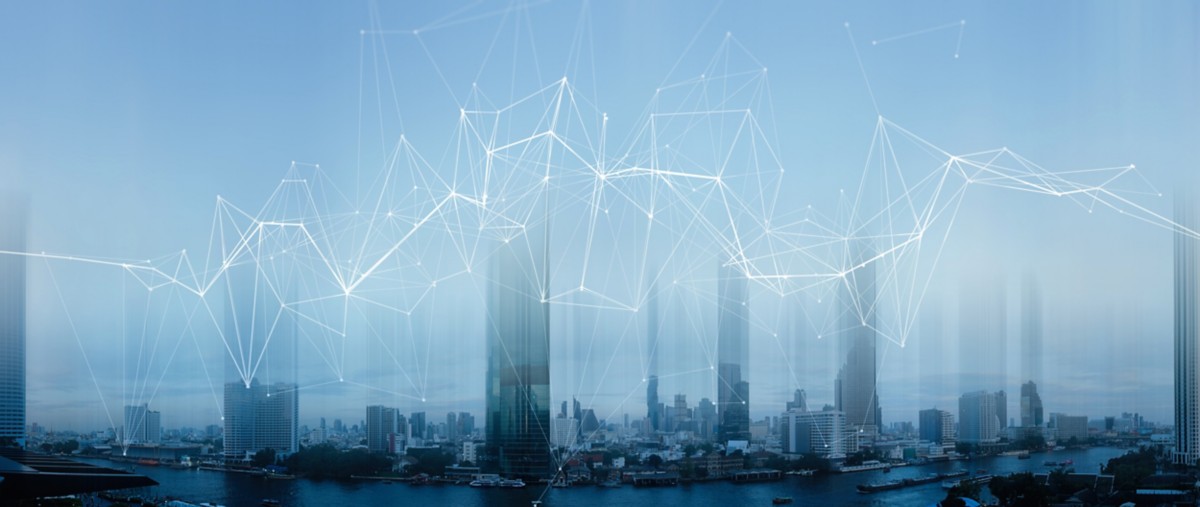 Close-up of a human face blending with digital code, representing Hogan’s API & Microservices solution | DXC Technology Insights