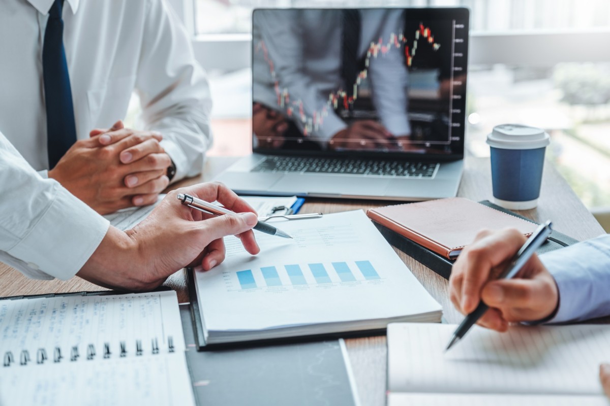 Close-up of a human face blending with digital code, representing Hogan’s API & Microservices solution | DXC Technology Insights