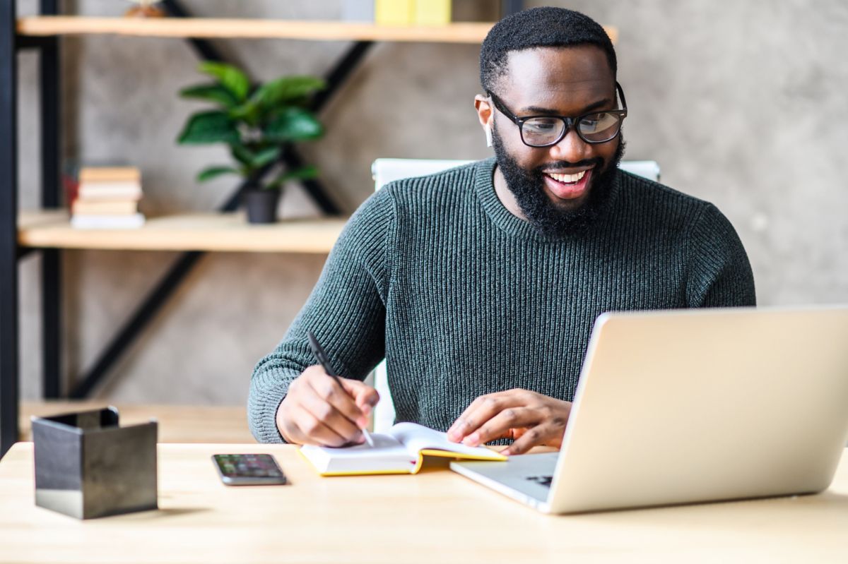 worker at desk at home | DXC Technology