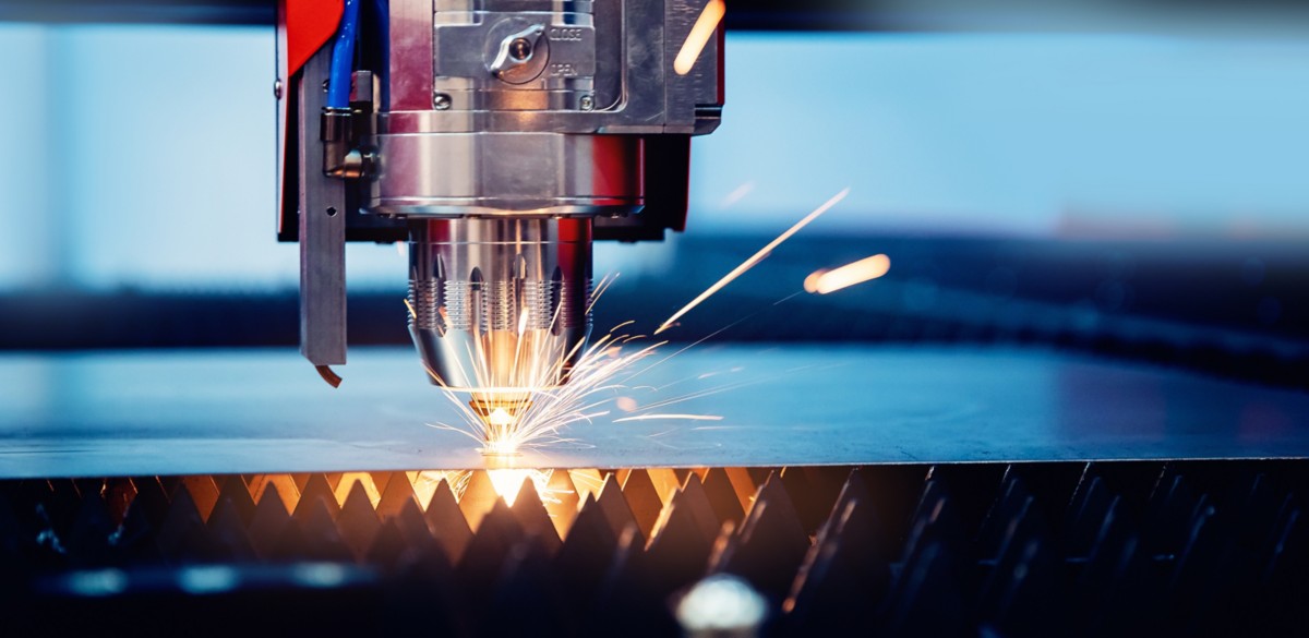 Blue color Laser CNC cut of metal with light spark, technology modern industrial banner.