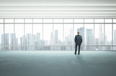 man looking out window, Total FinOps | DXC Technology