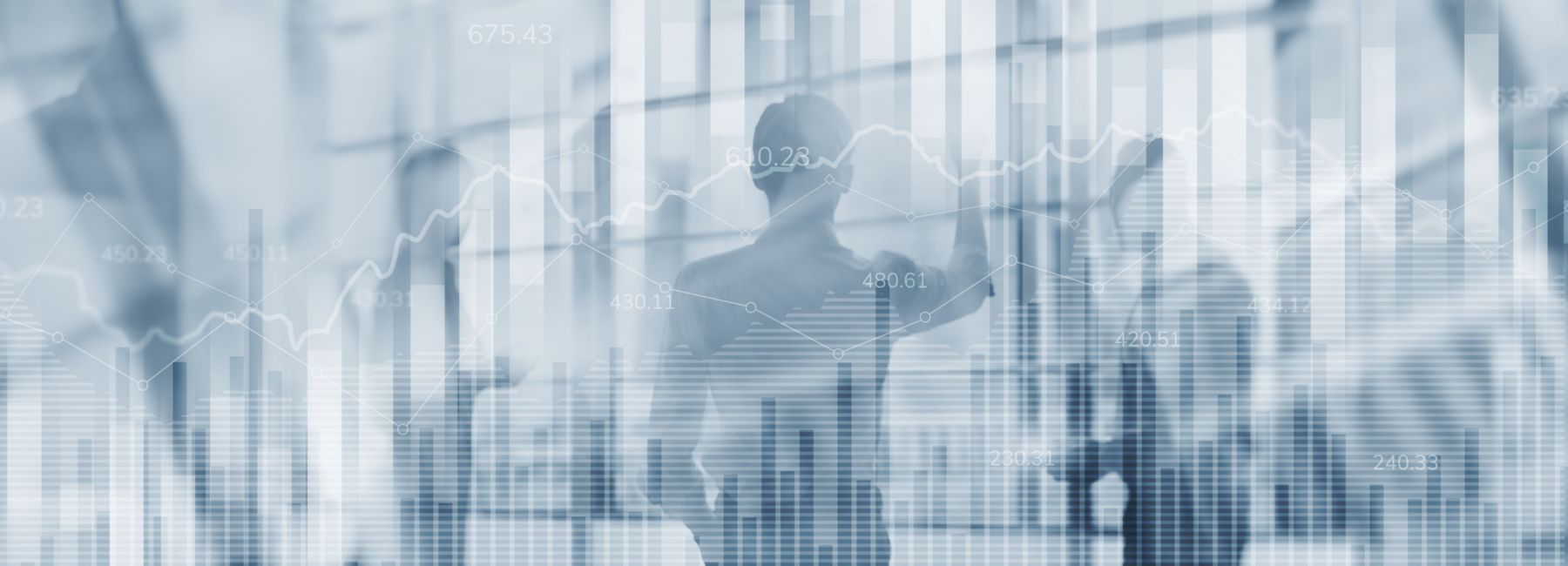 Professionals reviewing financial charts on a transparent screen, highlighting how AI-enabled modernization helps businesses cut costs, reduce risks, and minimize disruption | DXC Technology Insights