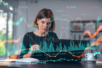 Female developer working in front of multiple screens, Trading Platform Health Check | DXC Technology