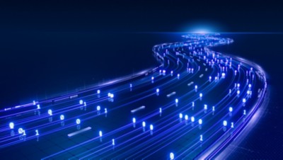 Pixelated blue lights on a digital highway curving towards a distant light, Connected mobility analytics | DXC Technology