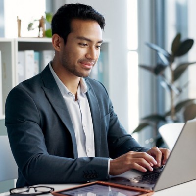 Happy, office laptop and professional man, legal advocate or government attorney with career smile, job experience or pride. Corporate portrait, law firm and professional lawyer working on project