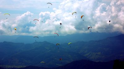 Air gliders flying above mountaintops and valleys, Public Cloud | DXC Technology
