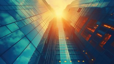 Morning sun reflecting on glass windows of office building, Cloud & Infrastructure | DXC Technology