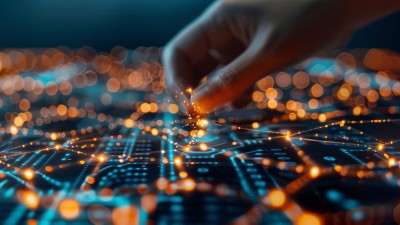 Hand connects to glowing node on circuit board - Five security trends shaping the future | DXC Technology Insights