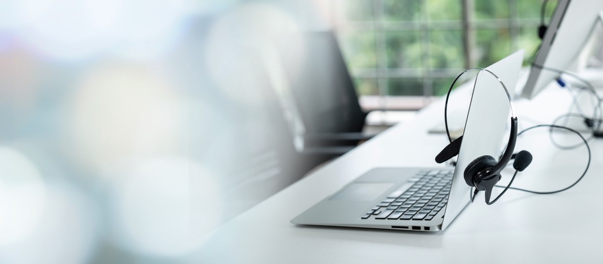 Headset and customer support equipment at call center ready for actively service . Corporate business help desk and telephone assistance concept .