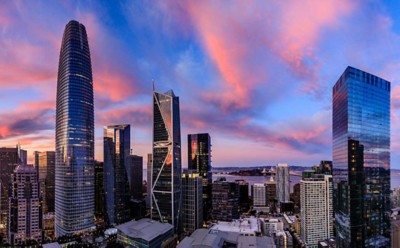 Epic panorama of a pink and blue sunset over San Francisco skyline with Salesforce Tower in the center and the bay bridge on the right