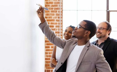 Businessman writing on a whiteboard