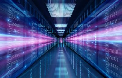 Dark blue mainframe room streaked with violet lights, Hybrid Cloud | DXC Technology Insights