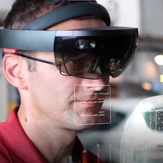 man with AR glasses and 3D auto image