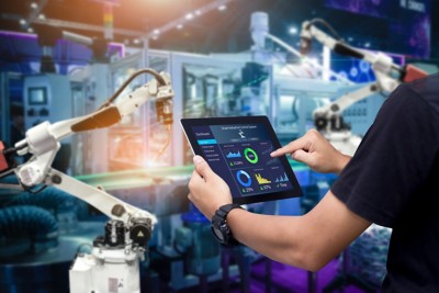 Smart industry control concept.Hands holding tablet on blurred automation machine as background, Smart industry control concept.Hands holding tablet on blurred a