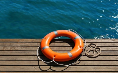 life buoy on a deck near water