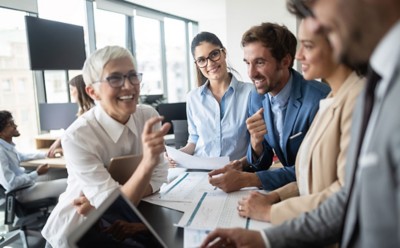 Group of young business people working and communicating at the office