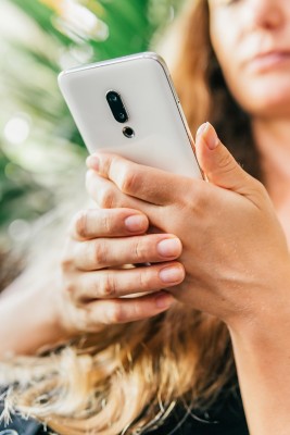 young woman using her mobile phone at home.