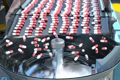 red and white medication in production