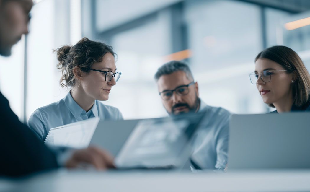 Team members using digital workplace services for collaboration and employee collaboration solutions | DXC Technology Customer story