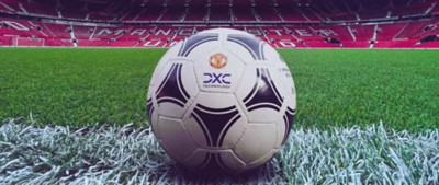 Football at Old Trafford with Manchester United logo and DXC logo