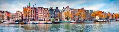 Panoramic autumn view of Amsterdam city. Famous Dutch channels and great cityscape. Colorful morning scene of Netherlands, Europe. Traveling concept background.