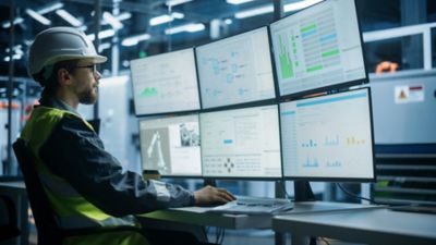 Technician analyzing data representing Energy & Commodity Trading, Financial services | DXC Technology