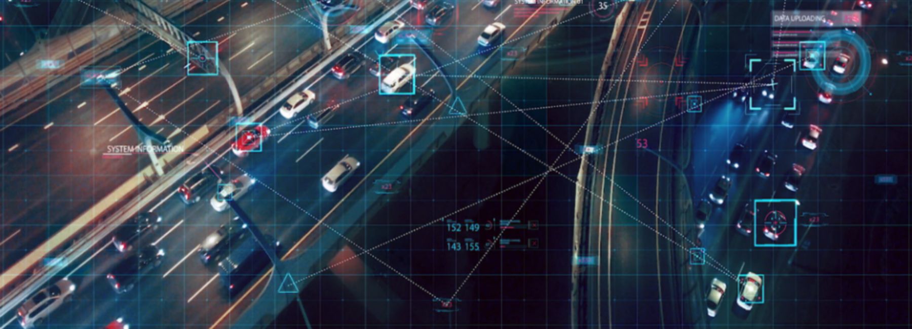 Aerial view of connected cars on city highway at night, Automotive | DXC Technology
