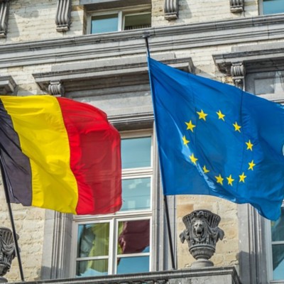 Belgium & EU flags flying - Demonstrating AI’s impact by starting small, thinking big | DXC Technology Insights