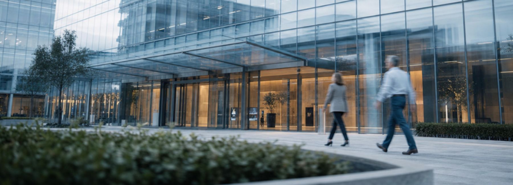 Employees work and collaborate in a modern office environment, illustrating the connected and people-centered workplace enabled by AI-powered services.