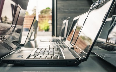 Old laptops next to each other, monitor open