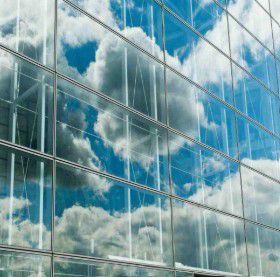 images of clouds reflected in building, Oracle | DXC Technology