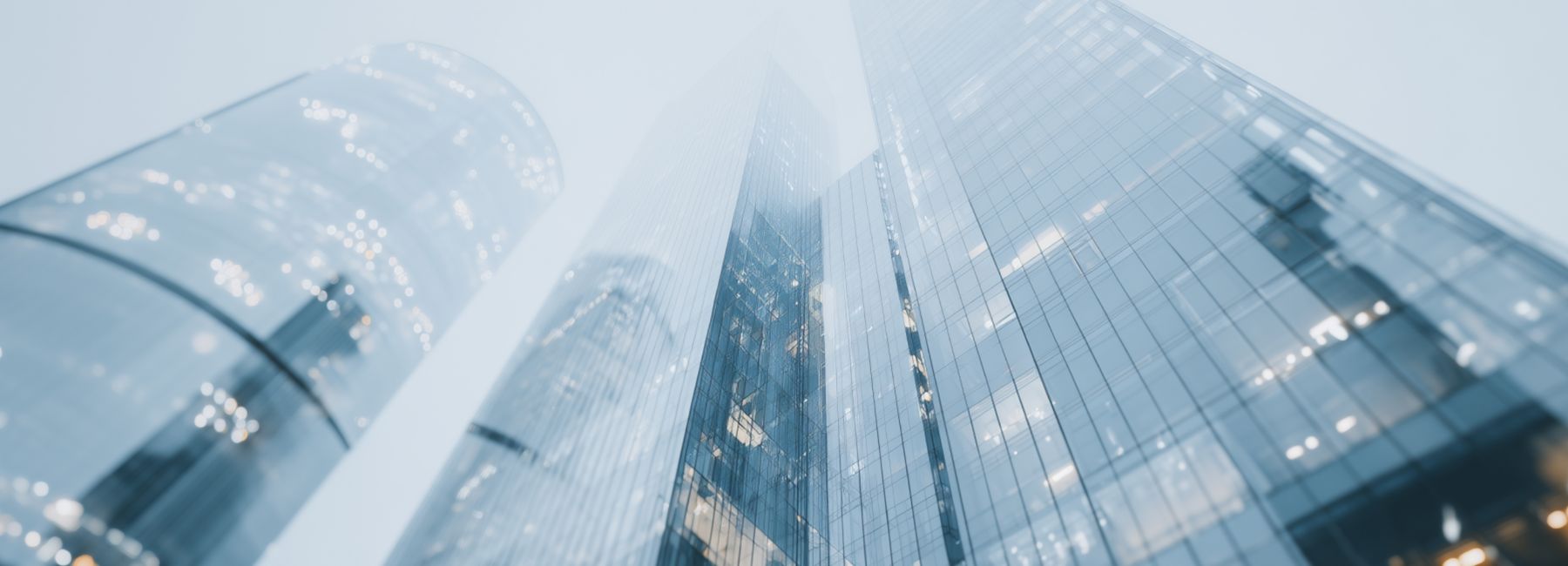 Upwards view of financial services buildings in European city, Financial Services, Insurance | DXC Technology Insights