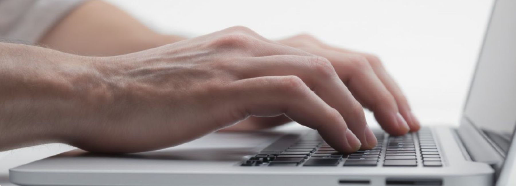 person working on laptop, Total FinOps | DXC Technology Insights