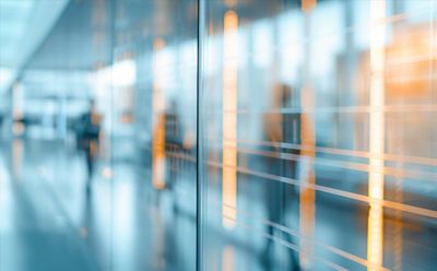 Glass doors of office building, representing transformation in Insurance industry | DXC Technology